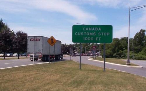  [Photo of Canadian/American customs] 